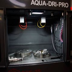 DPF cleaning machine with its chamber open