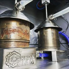 Two diesel particulate filters connected for cleaning