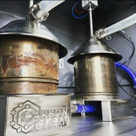 Two diesel particulate filters connected for cleaning