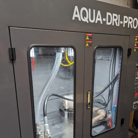 DPF cleaning machine with glass chamber doors