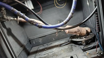 Diesel particulate filter connected to cleaning hoses