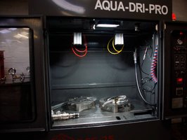DPF cleaning machine with its chamber open